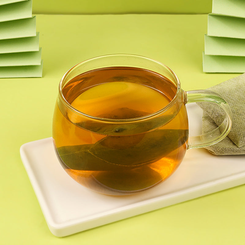Individual soursop leaf tea bag close-up detail
